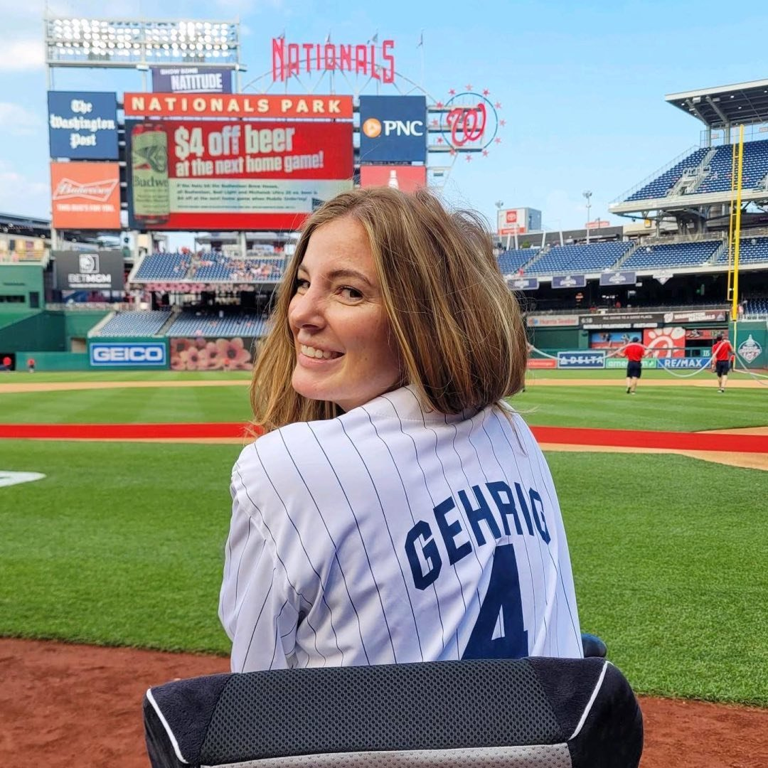 Brooke Eby smiling in a Gehrig jersey at Nationals Park